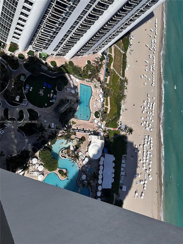 aerial view featuring a water view and a beach view