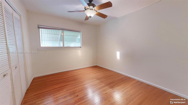 unfurnished bedroom with light hardwood / wood-style floors, a closet, and ceiling fan