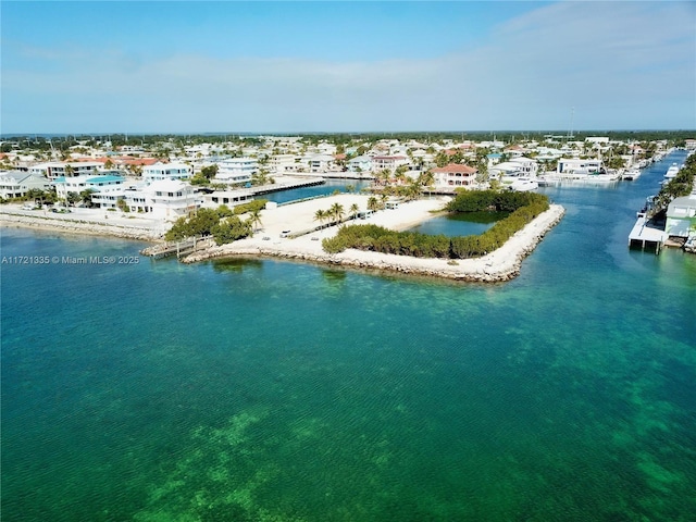 bird's eye view with a beach view and a water view