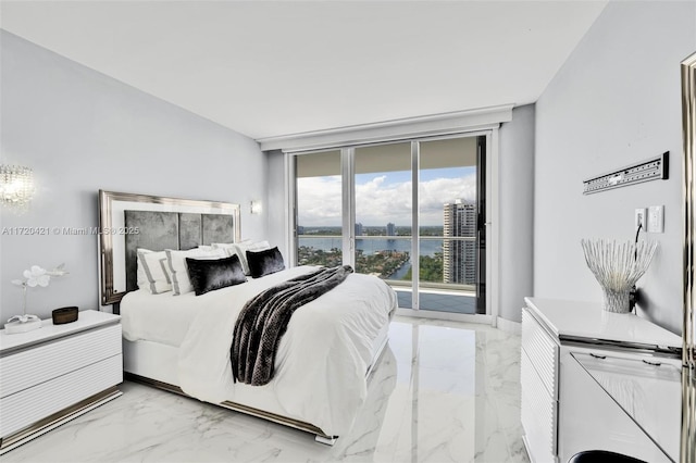 bedroom featuring floor to ceiling windows, access to exterior, and a water view