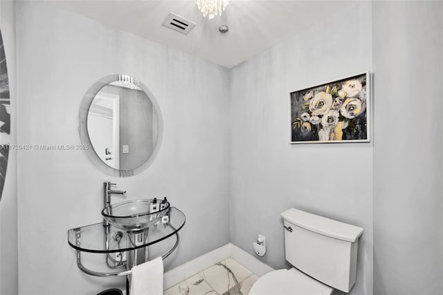 bathroom featuring sink and toilet