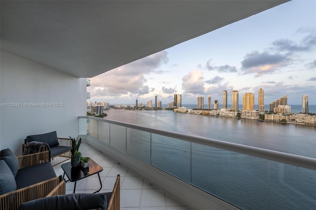 balcony featuring a water view