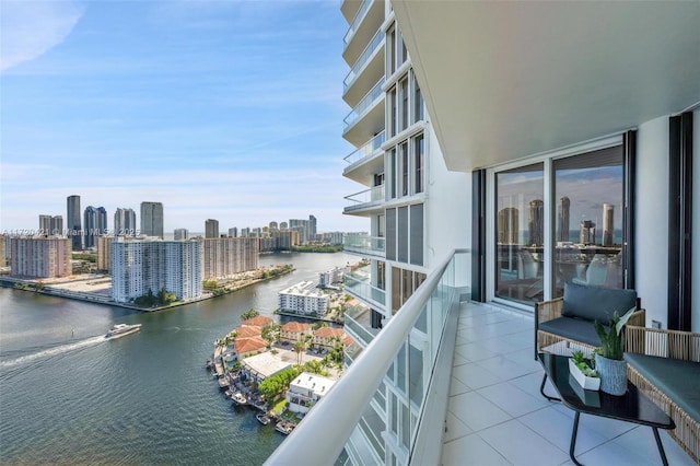 balcony featuring a water view