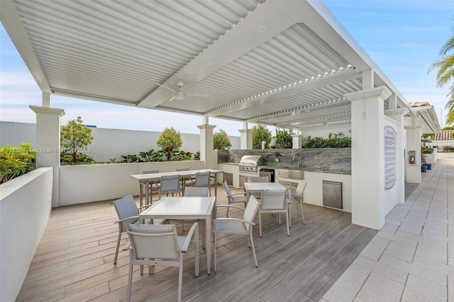 view of patio featuring sink, an outdoor kitchen, and area for grilling