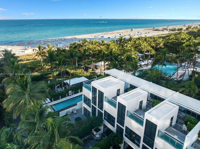 bird's eye view with a water view and a view of the beach