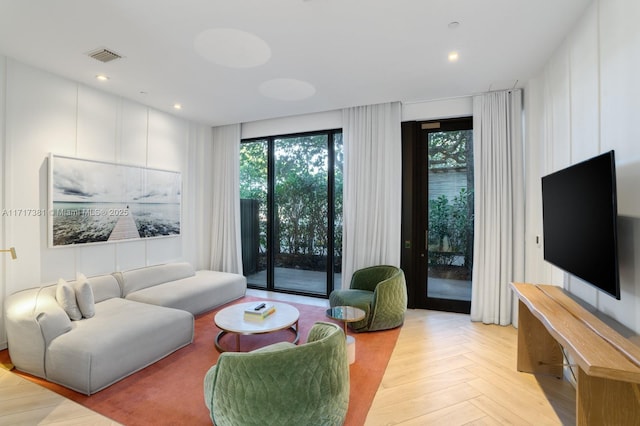 living room featuring light parquet flooring