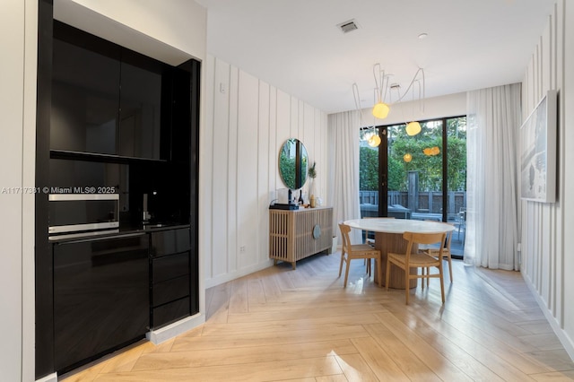 dining area with light parquet flooring