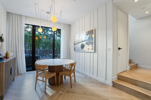 dining room featuring light parquet floors