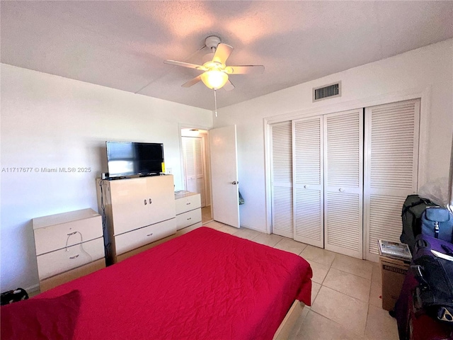 bedroom featuring ceiling fan and light tile patterned floors