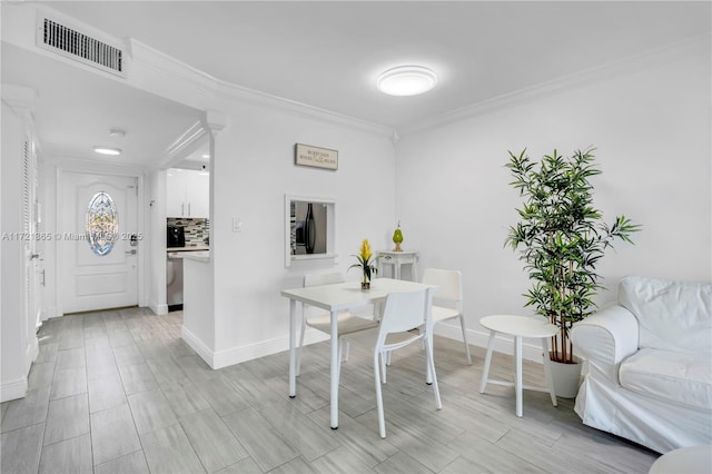 dining room with ornamental molding