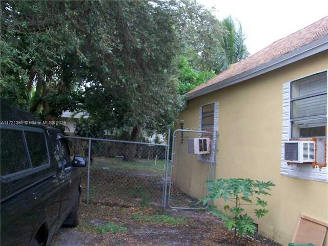 view of side of home featuring cooling unit