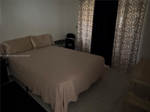 bedroom with light tile patterned flooring