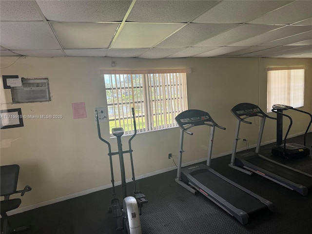 exercise room featuring a drop ceiling