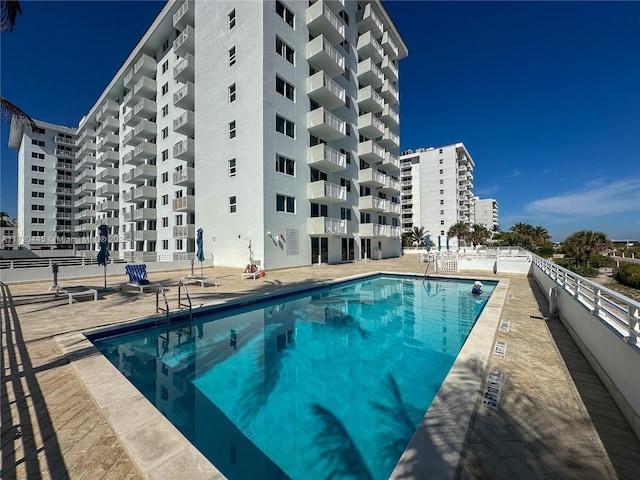 view of swimming pool with a patio area