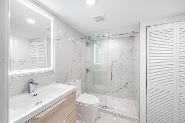 bathroom featuring vanity, toilet, an enclosed shower, and tile walls