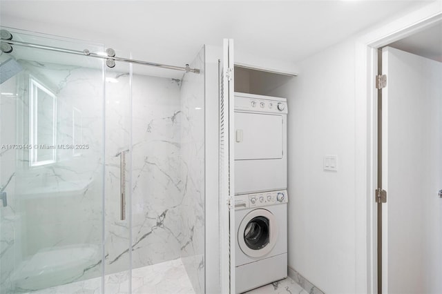 laundry room with stacked washer / drying machine