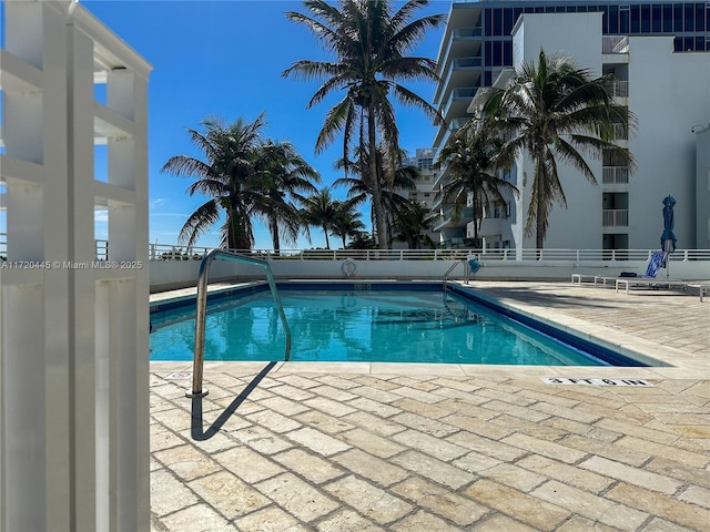 view of swimming pool featuring a patio