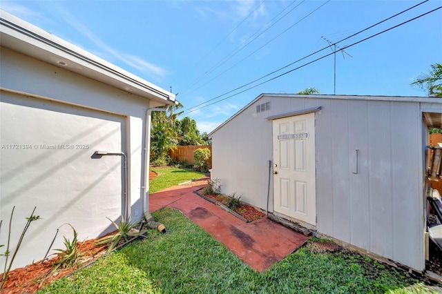 view of outbuilding with a lawn