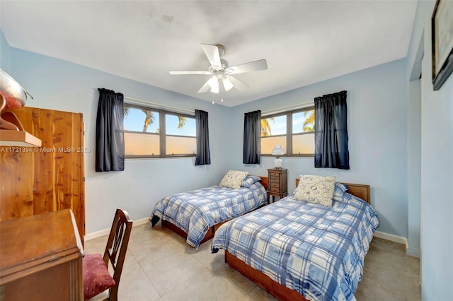 tiled bedroom featuring ceiling fan