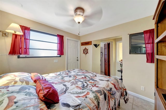 tiled bedroom with ceiling fan