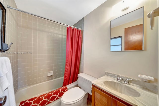 full bathroom featuring shower / tub combo with curtain, vanity, and toilet