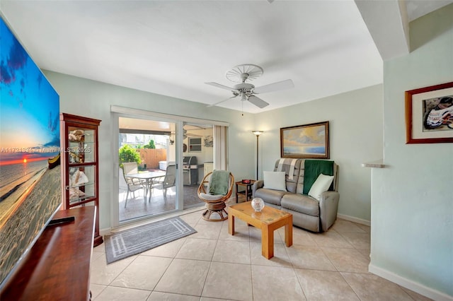 tiled living room with ceiling fan