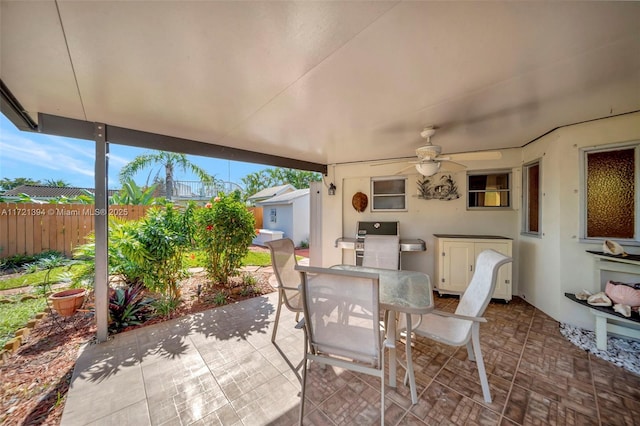 view of patio featuring ceiling fan