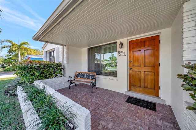 doorway to property with a porch