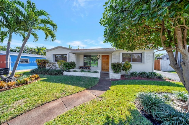 ranch-style house with a front yard