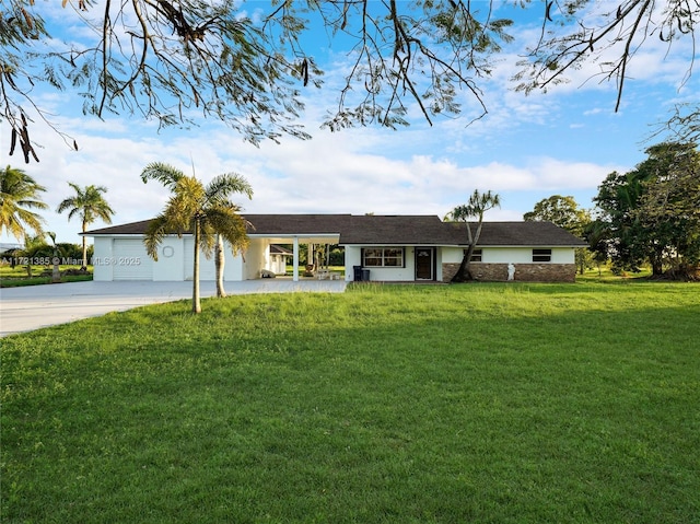 ranch-style home with a garage and a front yard