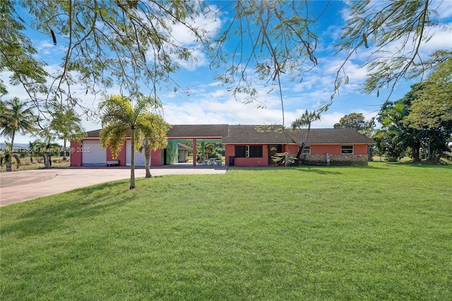 ranch-style home with a front lawn and a garage