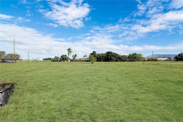 view of yard with a rural view