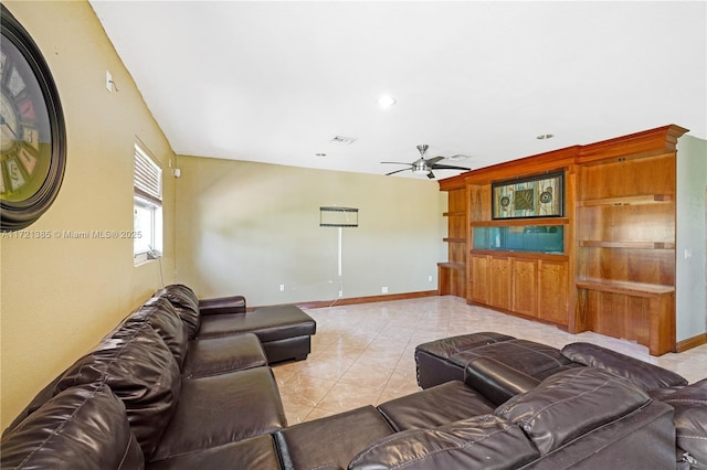 tiled living room with ceiling fan