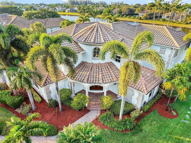 birds eye view of property with a water view