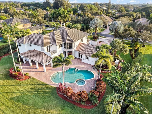 14403 S Jockey Cir S, Davie, FL 33330 - view of swimming pool featuring a gazebo, a pool with connected hot tub, a lawn, and a patio