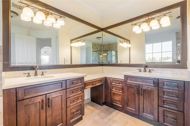 bathroom with a stall shower, tile patterned floors, ornamental molding, and vanity