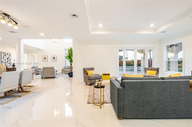 14403 S Jockey Cir S, Davie, FL 33330 - living area featuring marble tiled floors, recessed lighting, a raised ceiling, and french doors