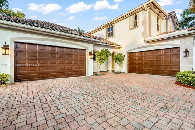14403 S Jockey Cir S, Davie, FL 33330 - mediterranean / spanish home with decorative driveway, stucco siding, and a tiled roof