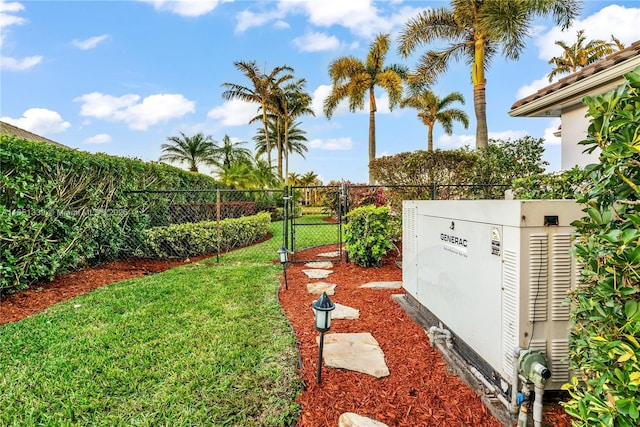 view of yard with fence and a gate