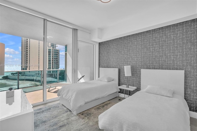 bedroom with access to outside and floor to ceiling windows