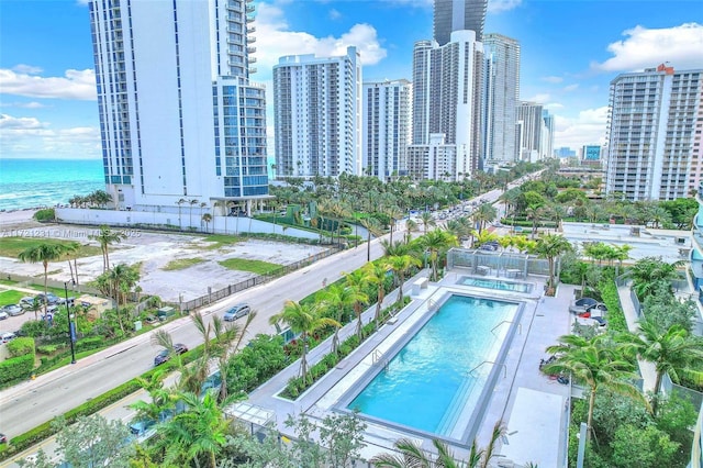 view of pool with a water view