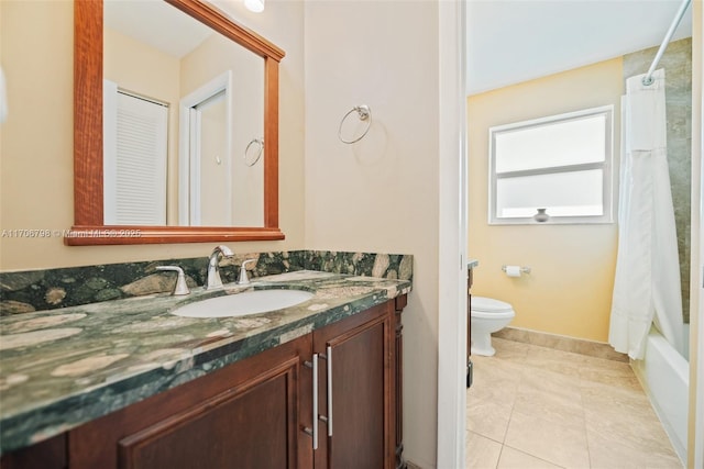 full bathroom with tile patterned floors, vanity, shower / tub combo, and toilet