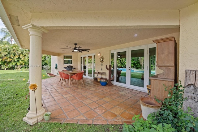 view of patio with french doors and ceiling fan