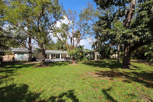 view of yard with a deck