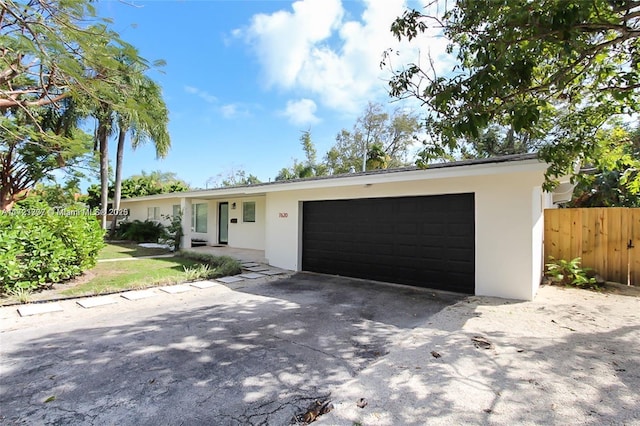 ranch-style home with a garage