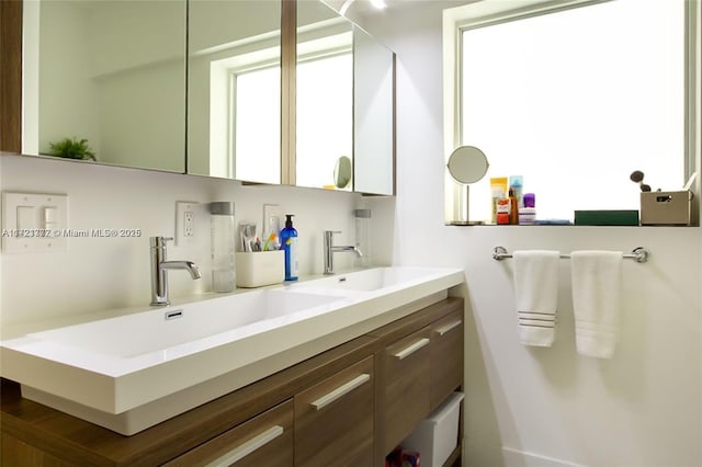 bathroom with a wealth of natural light and vanity