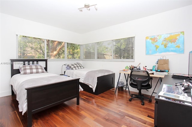 bedroom featuring hardwood / wood-style flooring