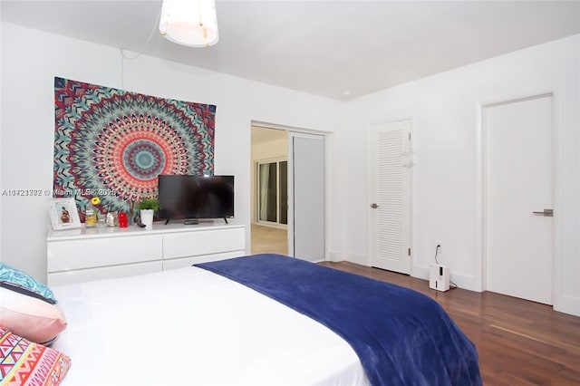 bedroom featuring dark hardwood / wood-style floors