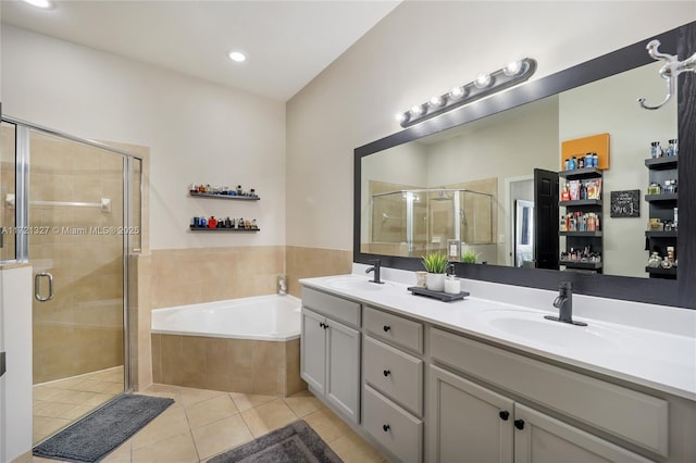 bathroom featuring tile patterned flooring, vanity, and plus walk in shower