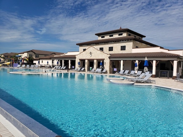 view of swimming pool with a patio